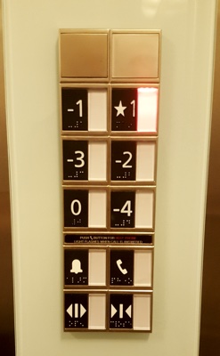 Two columns of elevator buttons reading from left to right and top to bottom -1, ⋆1, -3, -2, 0, -1.