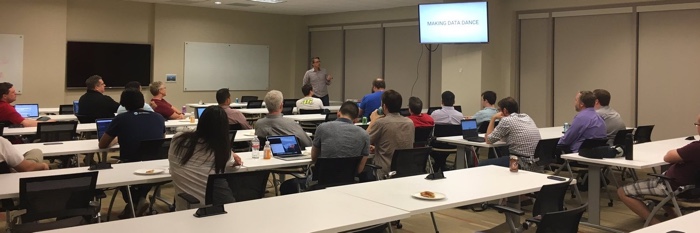 A Dallas Ruby Brigade meeting with a speaker talking to a room.